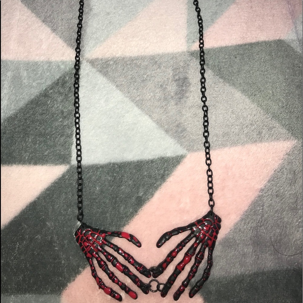 Cryptic hand necklace